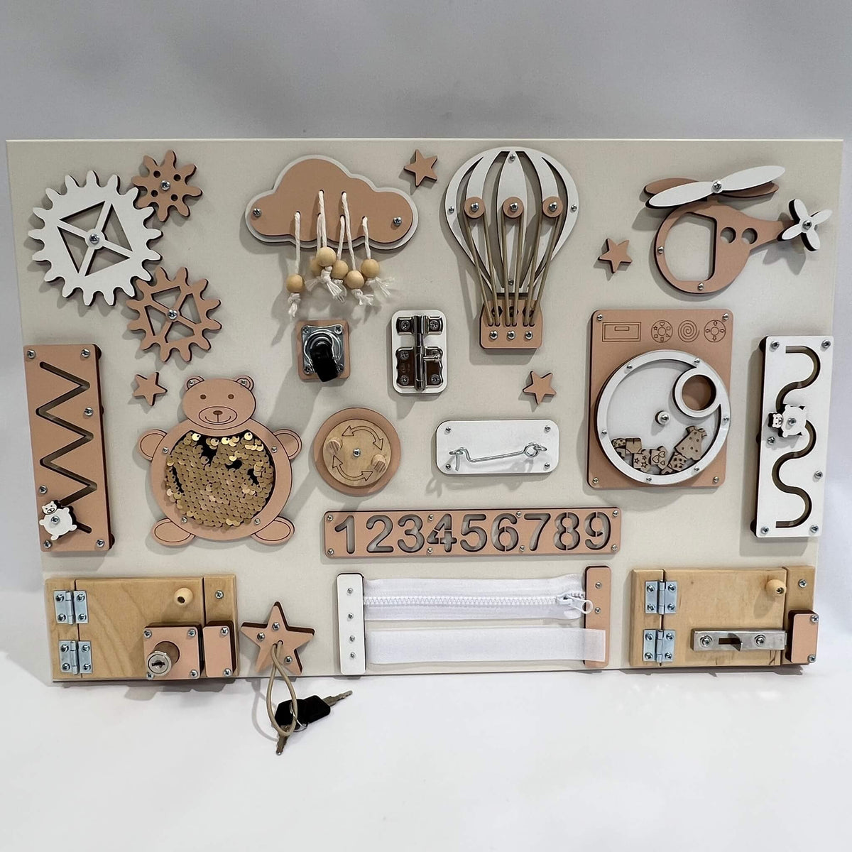 Montessori busy board with doors and locks (40×60 cm)
